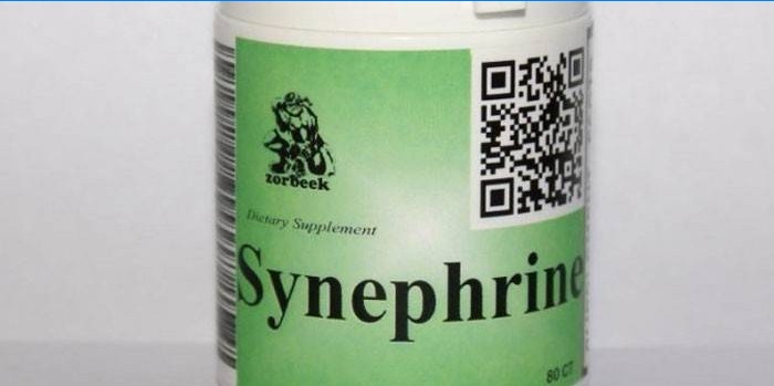 Synephrintabletten in einem Glas